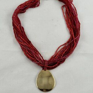 Red micro bead necklace with gold tone pendant, great vintage